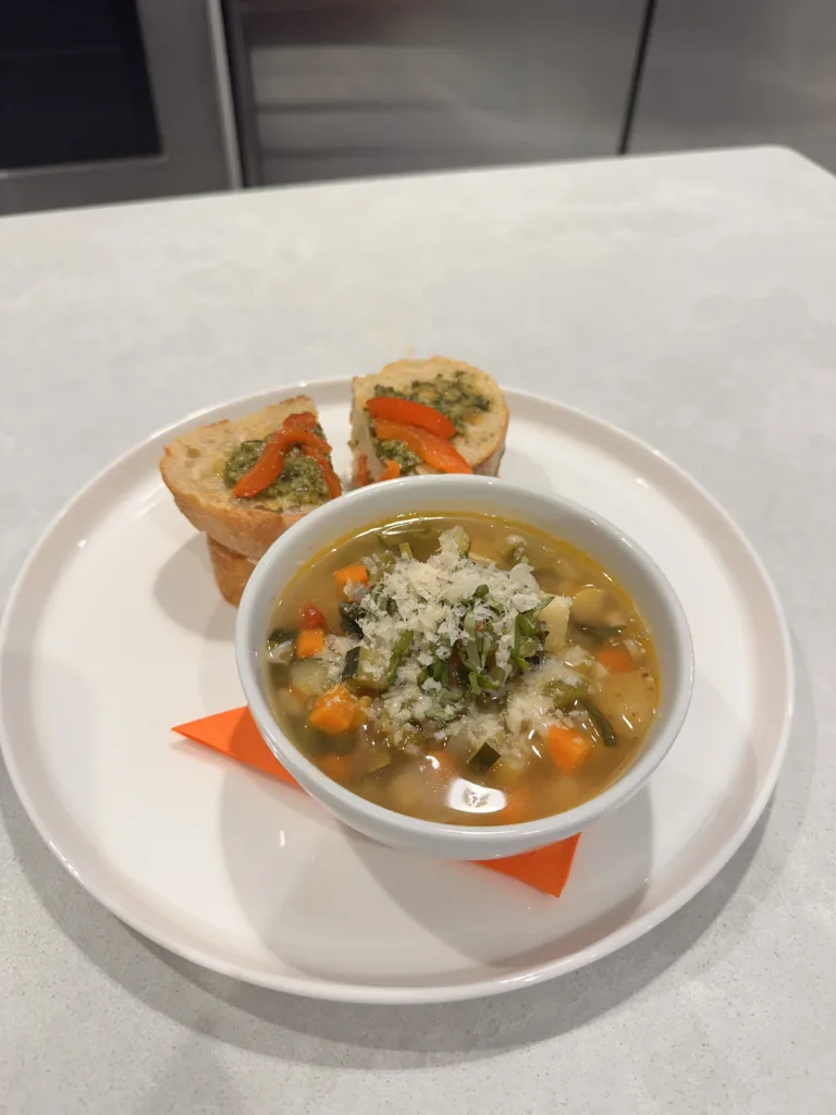Chicken and vegetable soup with rice, served with bread