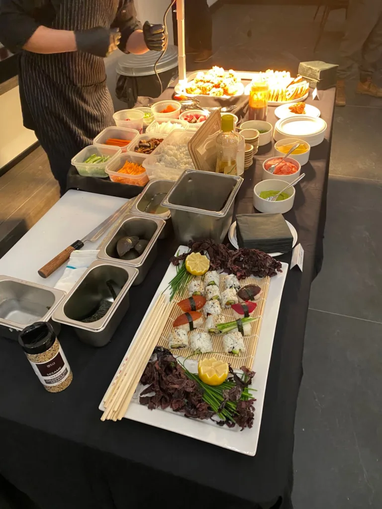 A chef-attended sushi station being prepared at a Monarch Culinary event