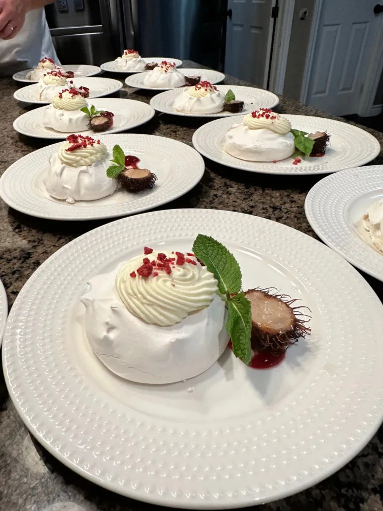 Individual pavlova desserts plated for service by Monarch Culinary