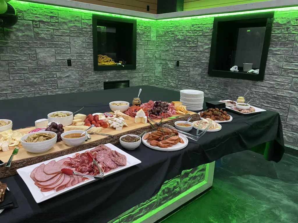 A charcuterie and grazing table set up by Monarch Culinary at an event