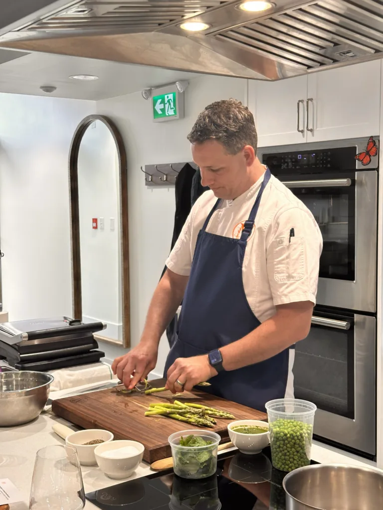 Chef Jason Miller trimming asparagus at the Monarch Culinary Studio