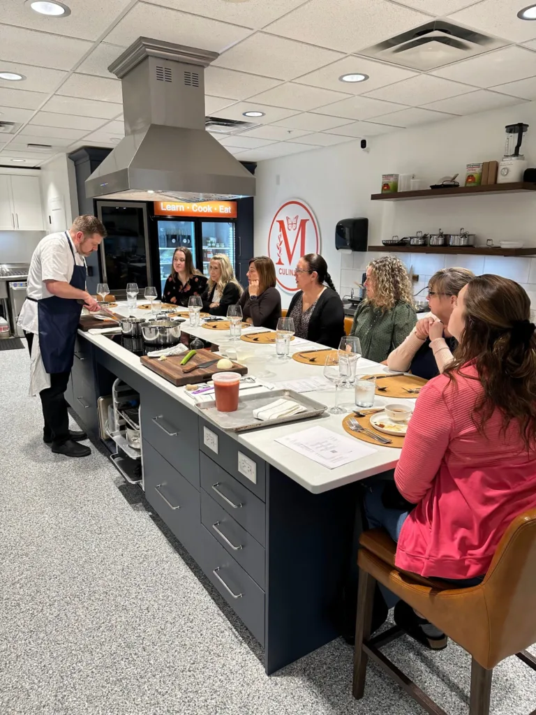 Chef-led cooking experience for a corporate group at the Monarch Culinary Studio