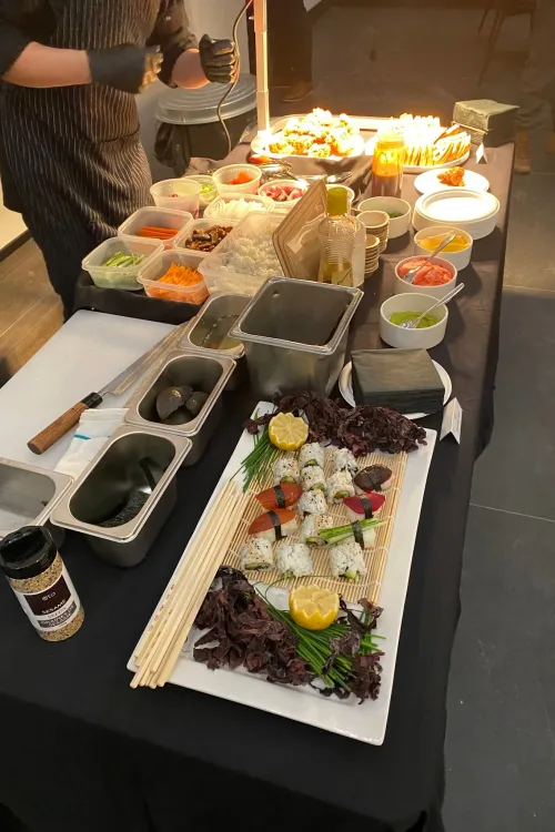 A chef-attended sushi station being prepared at a Monarch Culinary event