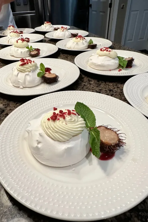 Individual pavlova desserts plated for service by Monarch Culinary