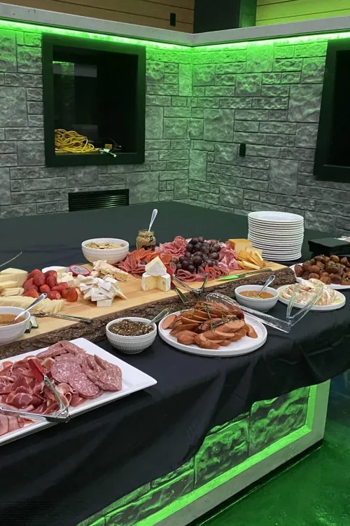 A charcuterie and grazing table set up by Monarch Culinary at an event