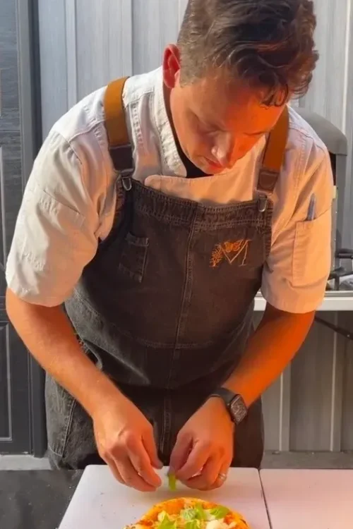 Monarch Culinary chef plating a dish at the studio