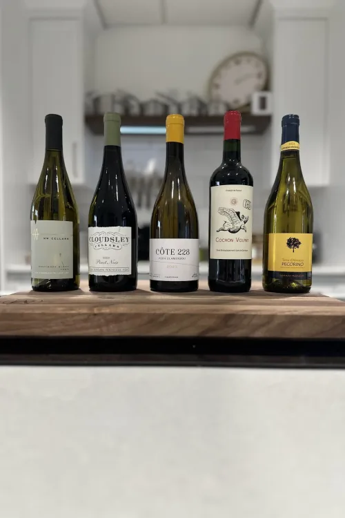 Ontario and international wines displayed on a walnut board at the studio