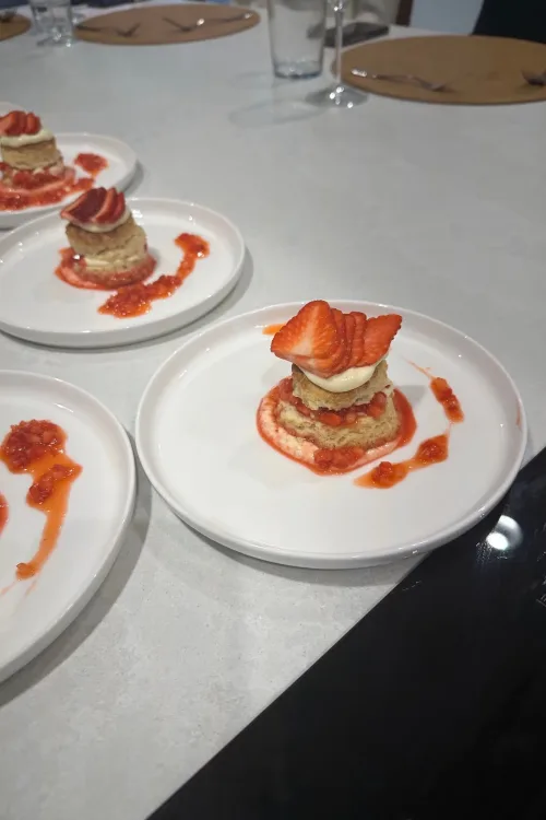 Strawberry shortcakes plated for service by Monarch Culinary